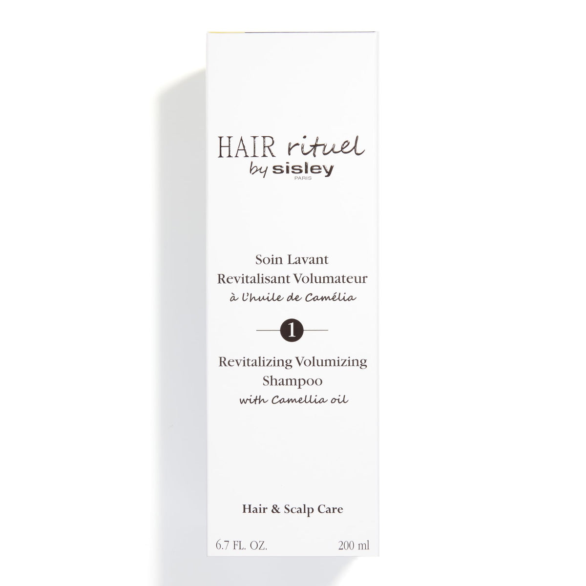 HAIR RITUEL BY SISLEY size comparison with 200 mL bottle for scale and travel convenience