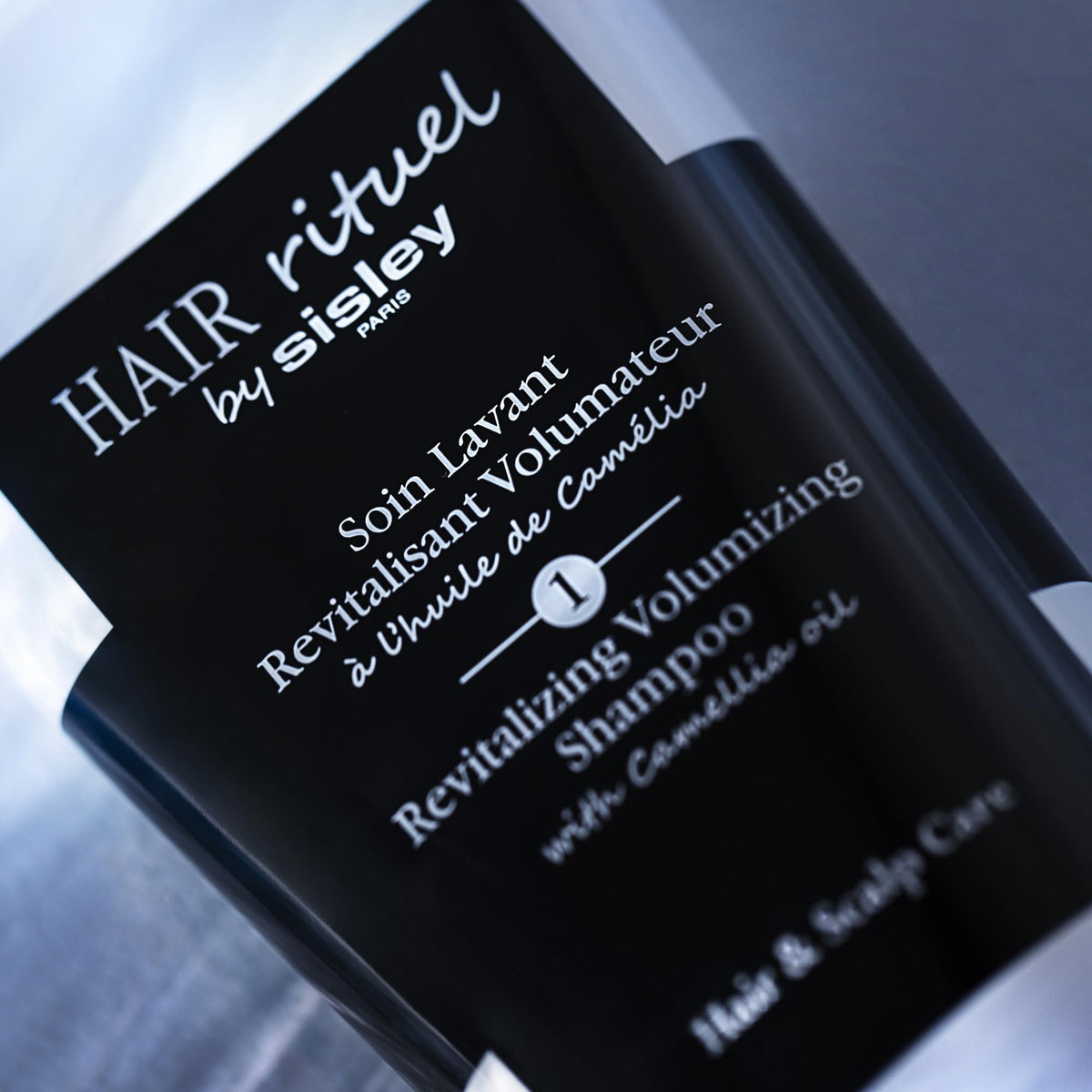 HAIR RITUEL BY SISLEY in-shower application showing scalp massage for fuller-looking hair
