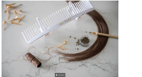 Hair Works in salon while stylist blow-dries extensions for consistent styling benefit