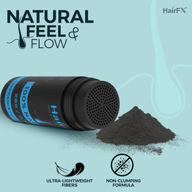 Close-up texture of HairFX black fibers highlighting natural blend and fine particles