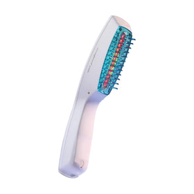 HairMax Ultima 12 held in hand to show size and portability for daily treatment convenience