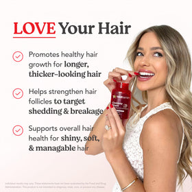 HAIRtamin gummies in hand demonstrating serving size and convenient daily use