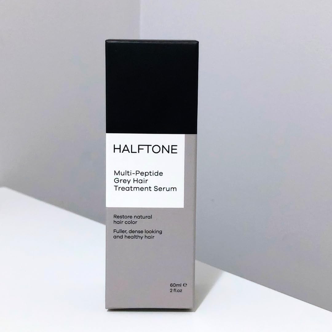 HALFTONE applying serum to scalp demonstrating targeted grey treatment