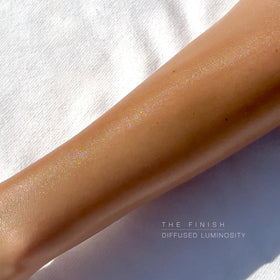 Hampton Sun applied on shoulder in beach setting for protected radiant skin
