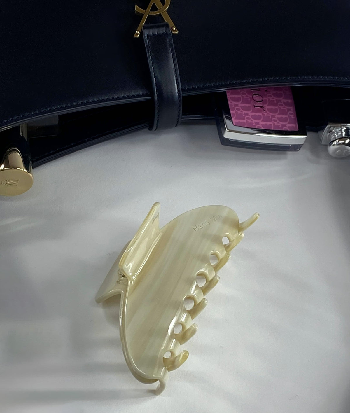 Hana Mia clip inside its soft carrying pouch protecting finish and easing travel