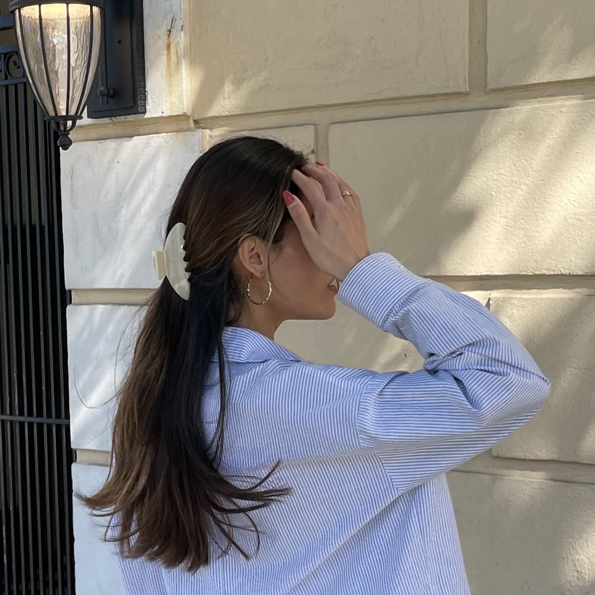 Hana Mia clip securing a half-up hairstyle demonstrating quick morning styling benefit