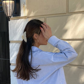 Hana Mia clip securing a half-up hairstyle demonstrating quick morning styling benefit