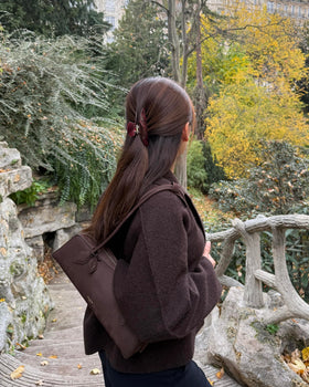 Hana Mia clip holding a half-up hairstyle on model adding color and tidy hold