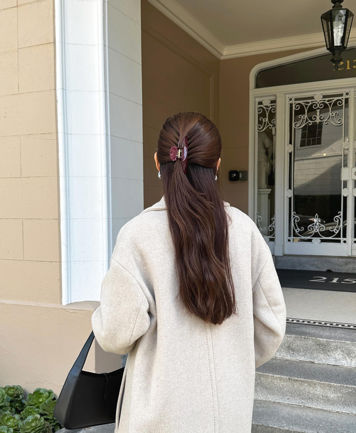 Hana Mia clip creating a messy bun demonstrating quick styling and dependable hold