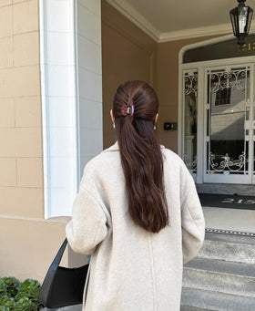 Hana Mia clip creating a messy bun demonstrating quick styling and dependable hold