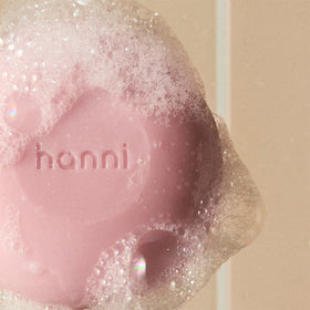 HANNI creamy Cocoon Cleanse texture on hand, demonstrating rich lather and moisturizing feel