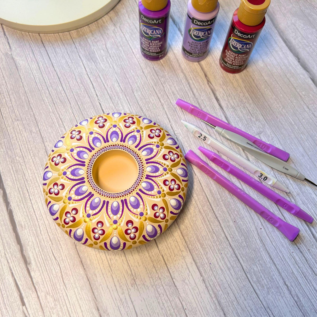 Happy Dotting Company creating almond-shaped nail art accents with ovals