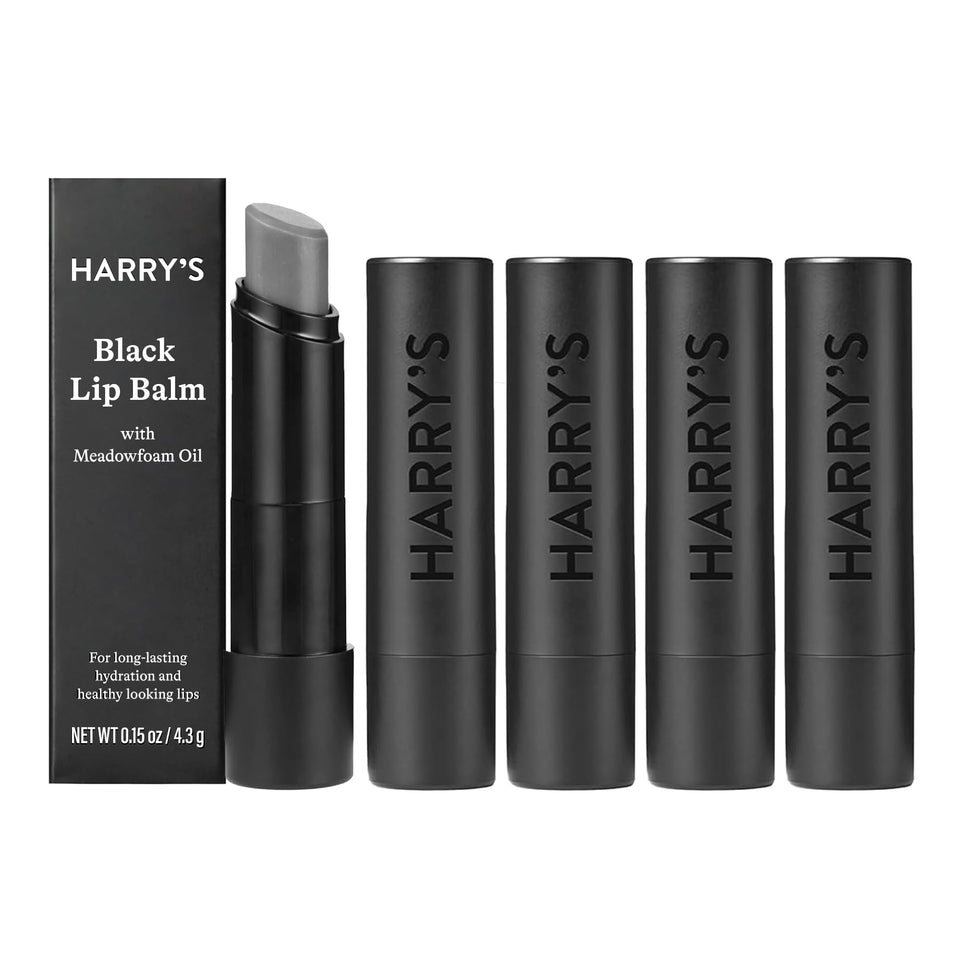 Harry's black lip balm front tube showing sleek matte design and portability