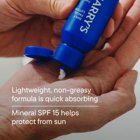 Harry's bottle inside a dopp kit showing travel-ready size and portability benefit