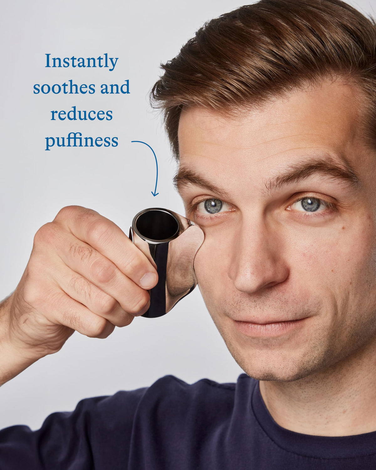Harry's weighted zinc gua sha tool detail showing ergonomic shape and effect