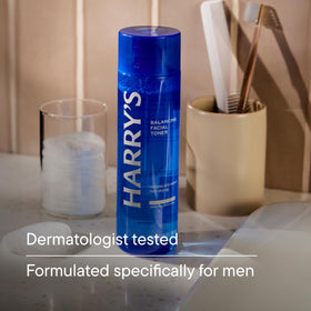 Harry's pouring toner onto hand to show lightweight hydration