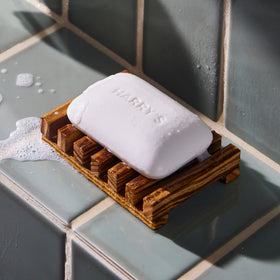 Rich foam from Harry's Stone soap in hand demonstrating effective cleansing