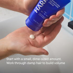 Harry's cream texture on fingertip illustrating lightweight, non-greasy finish