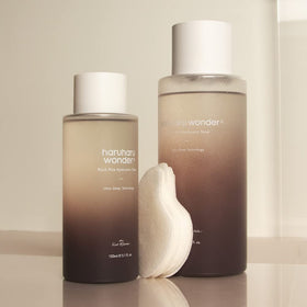 HARUHARU size comparison in hand showing generous 10.1 fl.oz bottle for long use