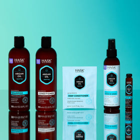 HASK argan oil bottles styled on bathroom vanity for an everyday routine