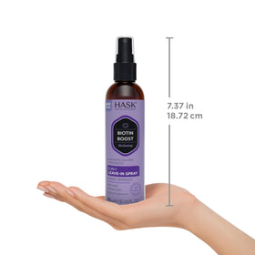 HASK bottles held in hand to show travel-friendly size benefit