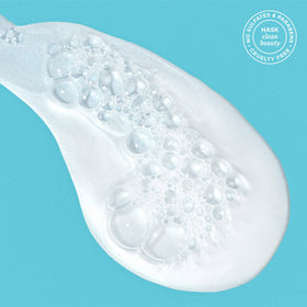 HASK argan oil shampoo texture on palm showing creamy lather and hydration