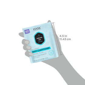 HASK packette being applied to damp hair to deliver argan oil hydration and repair