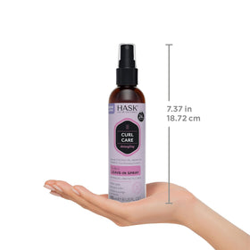 HASK spray being applied to detangle hair for easier styling