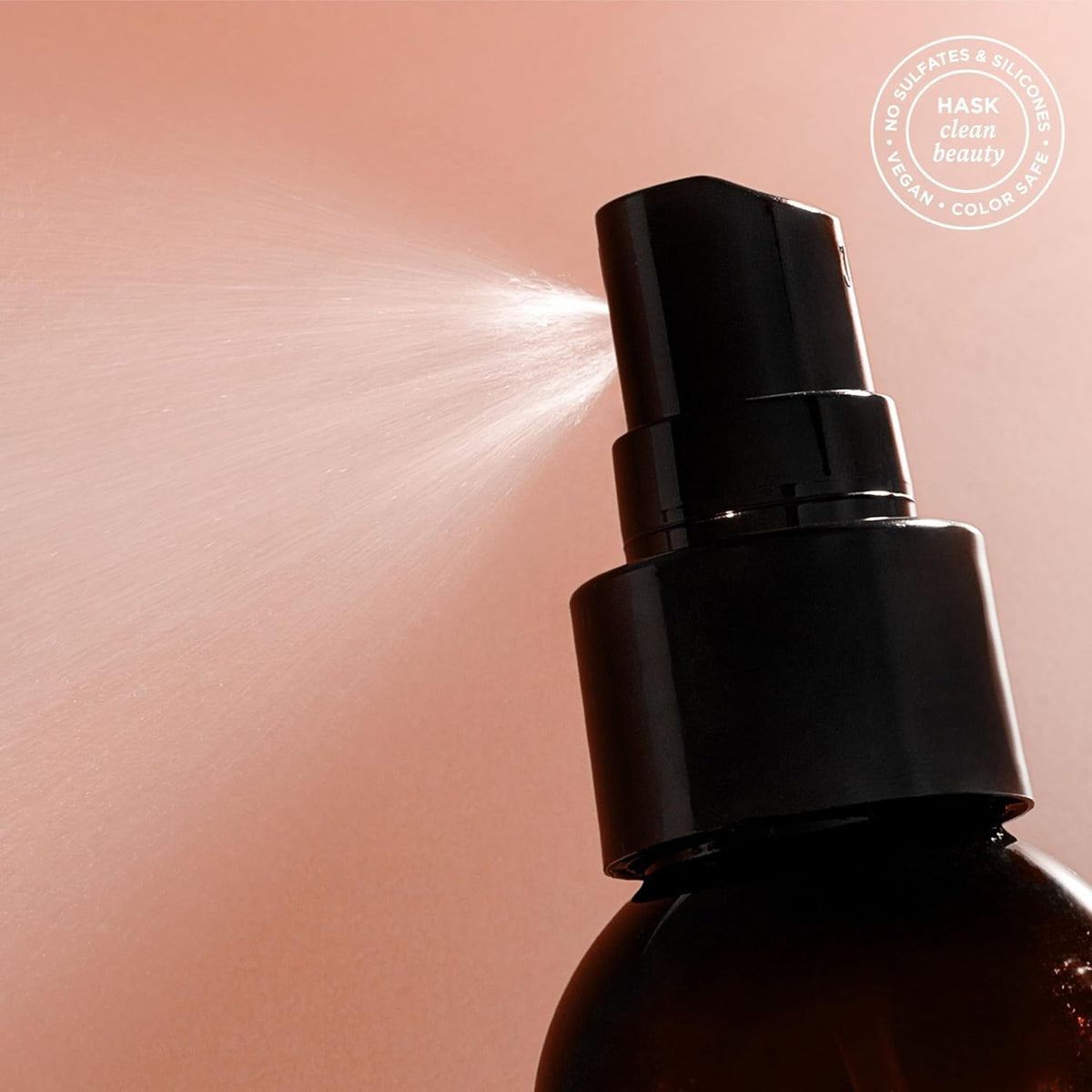 HASK creamy leave-in texture on hand highlighting lightweight absorption benefit