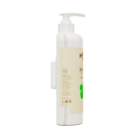 Hawaiian Tropic shampoo lather texture on palm showing rich foam and gentle cleanse