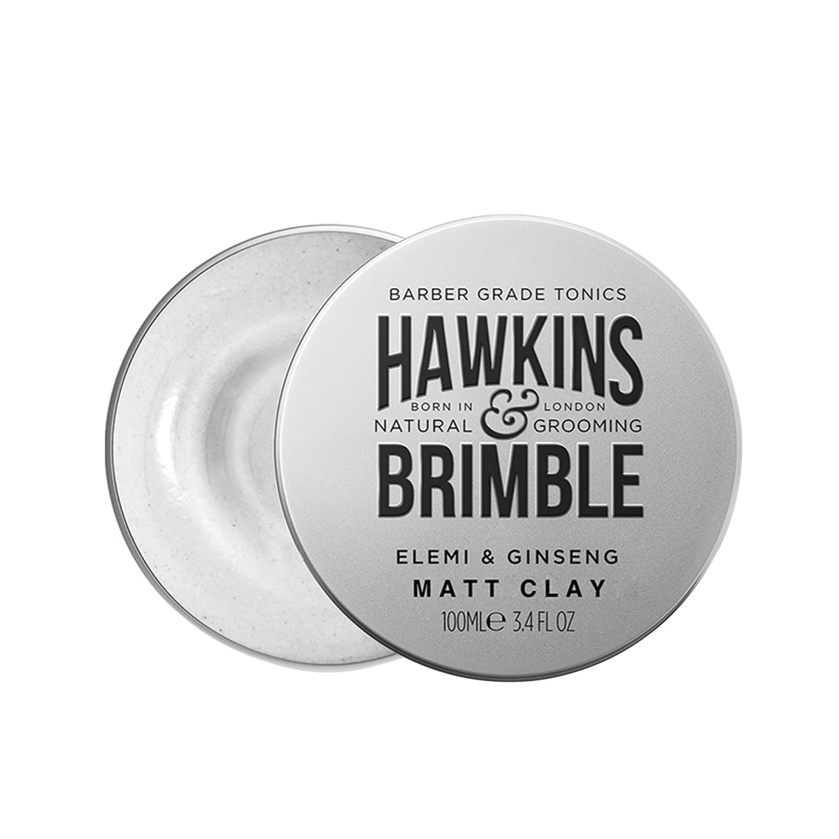 Hawkins & Brimble rinsing hair to show easy washout and low-residue finish after styling