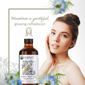 HBNO applying black seed oil to hair for conditioning boost