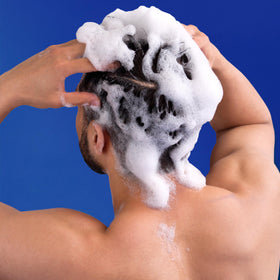 head & shoulders bottles on shower shelf in a tidy routine lifestyle setting