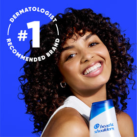 Head & Shoulders ingredient label closeup highlighting 1% pyrithione zinc and tea tree benefit