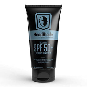 HeadBlade HeadLube placed with grooming kit showing daily routine compatibility