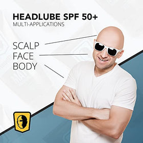 HeadBlade HeadLube tube in hand illustrating compact travel-friendly size