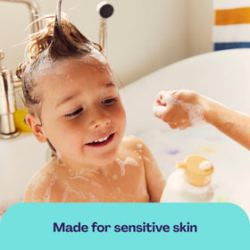 Hello Bello used in baby bath with caregiver demonstrating calm, tear-free wash