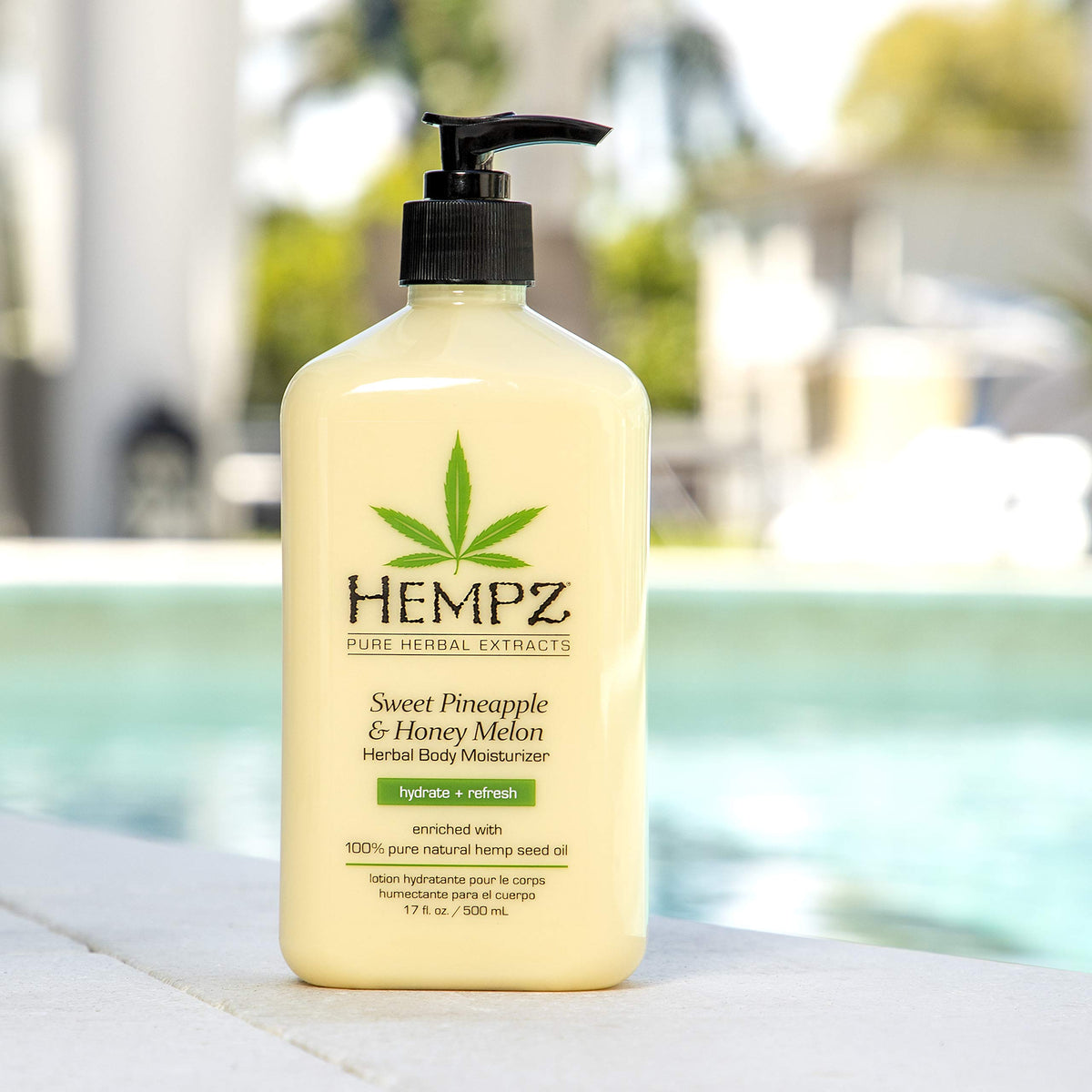 Hempz bottle held in hand for scale showing generous 17 oz size benefit