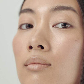 HennÃ Organics open tube revealing creamy consistency and easy application