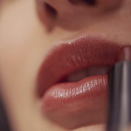 Henné Organics tube staged in lifestyle setting conveying luxury on-the-go