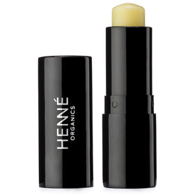Henné Organics front packaging showing sleek black metal tube and brand luxury