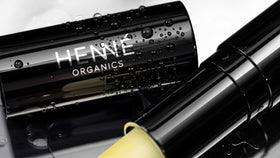 Henné Organics metal tube detail emphasizing durable, premium packaging benefit