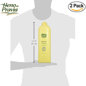 Heno de Pravia bottle on shower shelf staged for everyday use and easy reach