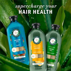 Herbal Essences hair before and after image showing improved smoothness and shine