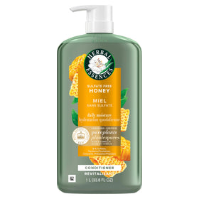 Herbal Essences bottle staged with aloe and honey to highlight botanical moisturizing benefits
