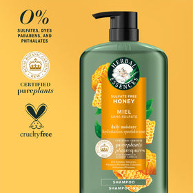 Herbal Essences bottle in hand demonstrating 33.8 oz size and convenience