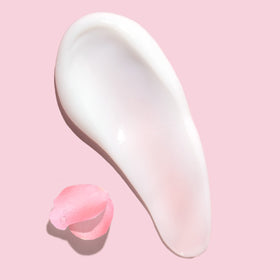 Herbal Essences shampoo in hand illustrating smooth application