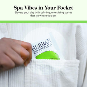 Herban Essentials wipes beside travel bag illustrating portable refreshment during trips