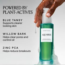 HERBIVORE pump dispensing cleanser into wet palm to demonstrate easy application and control