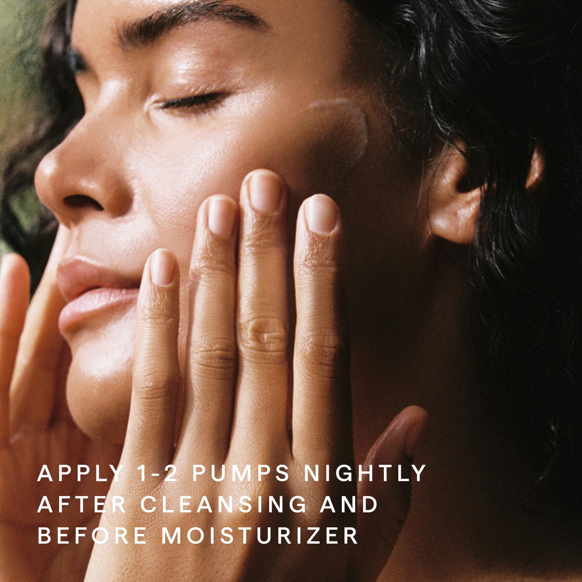 HERBIVORE bottle on nightstand next to skincare for calming nighttime routine benefit